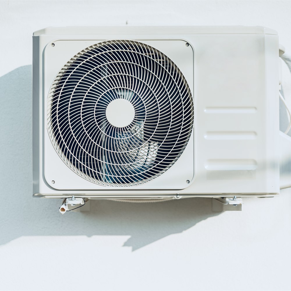 air-conditioner-on-wall-with-shadow Air conditioner on wall