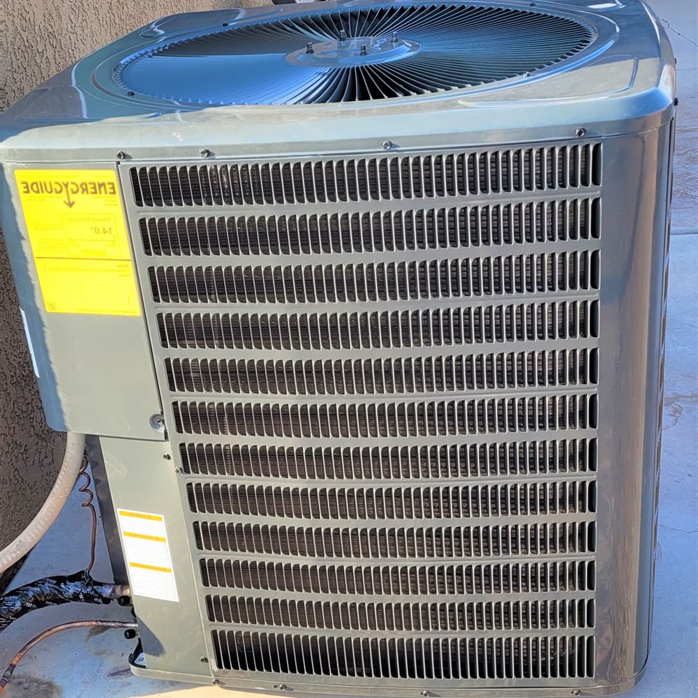 Air conditioner unit on concrete slab outdoors