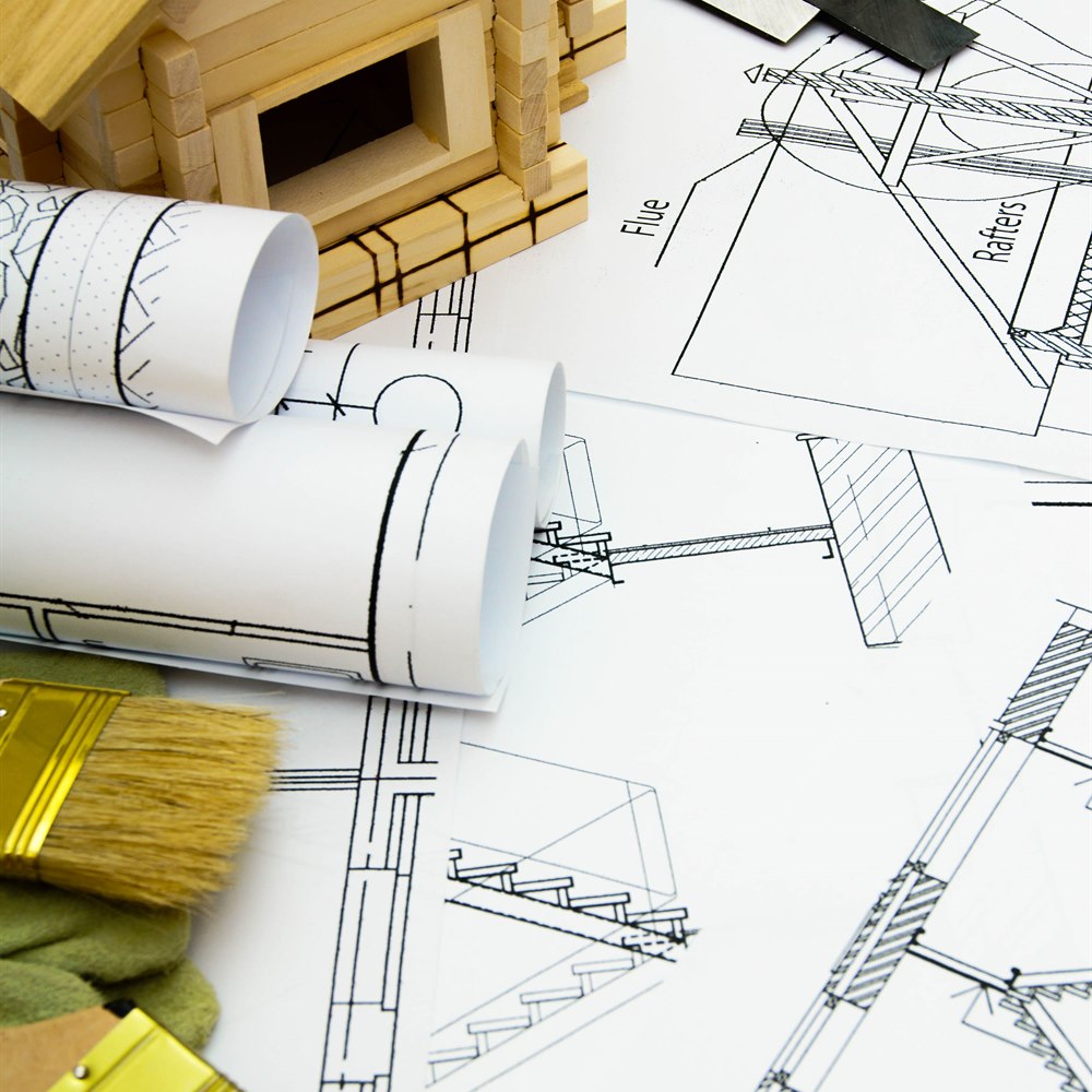 Architectural plans with house model and tools