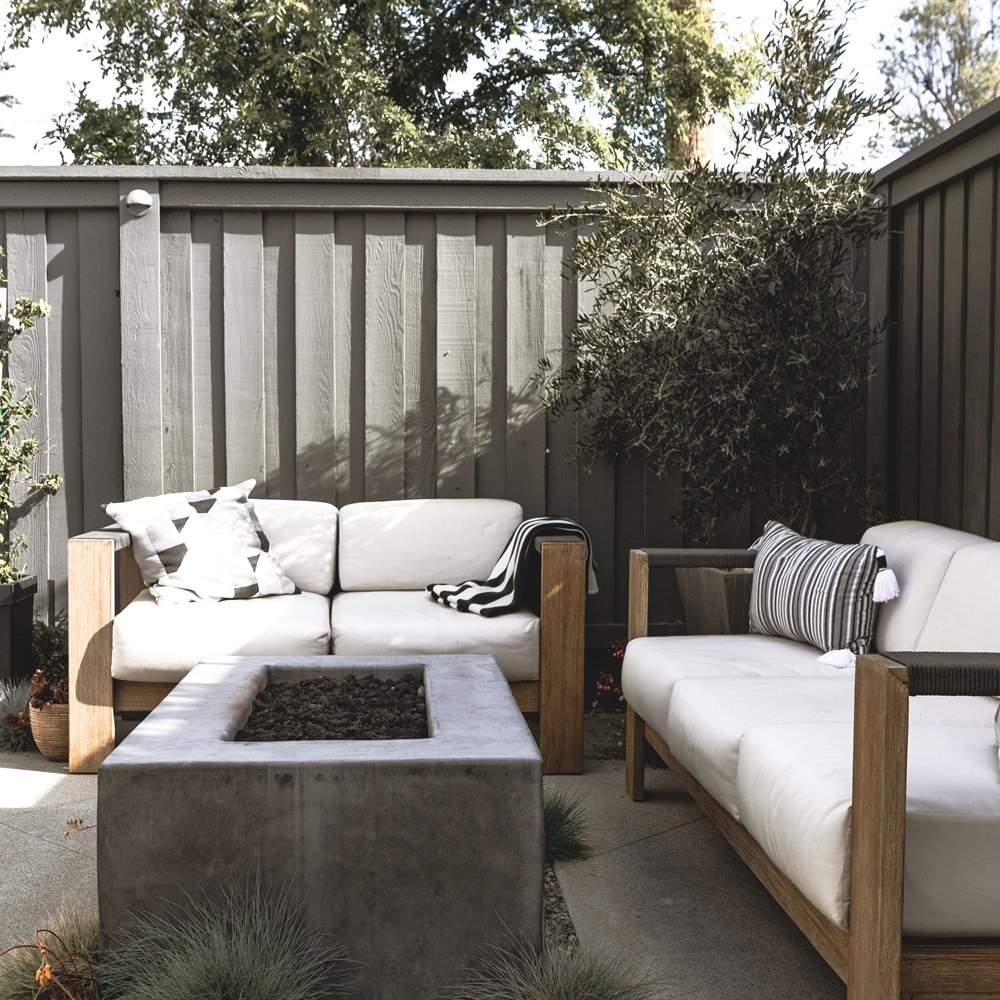 Backyard patio with sofas and fire pit
