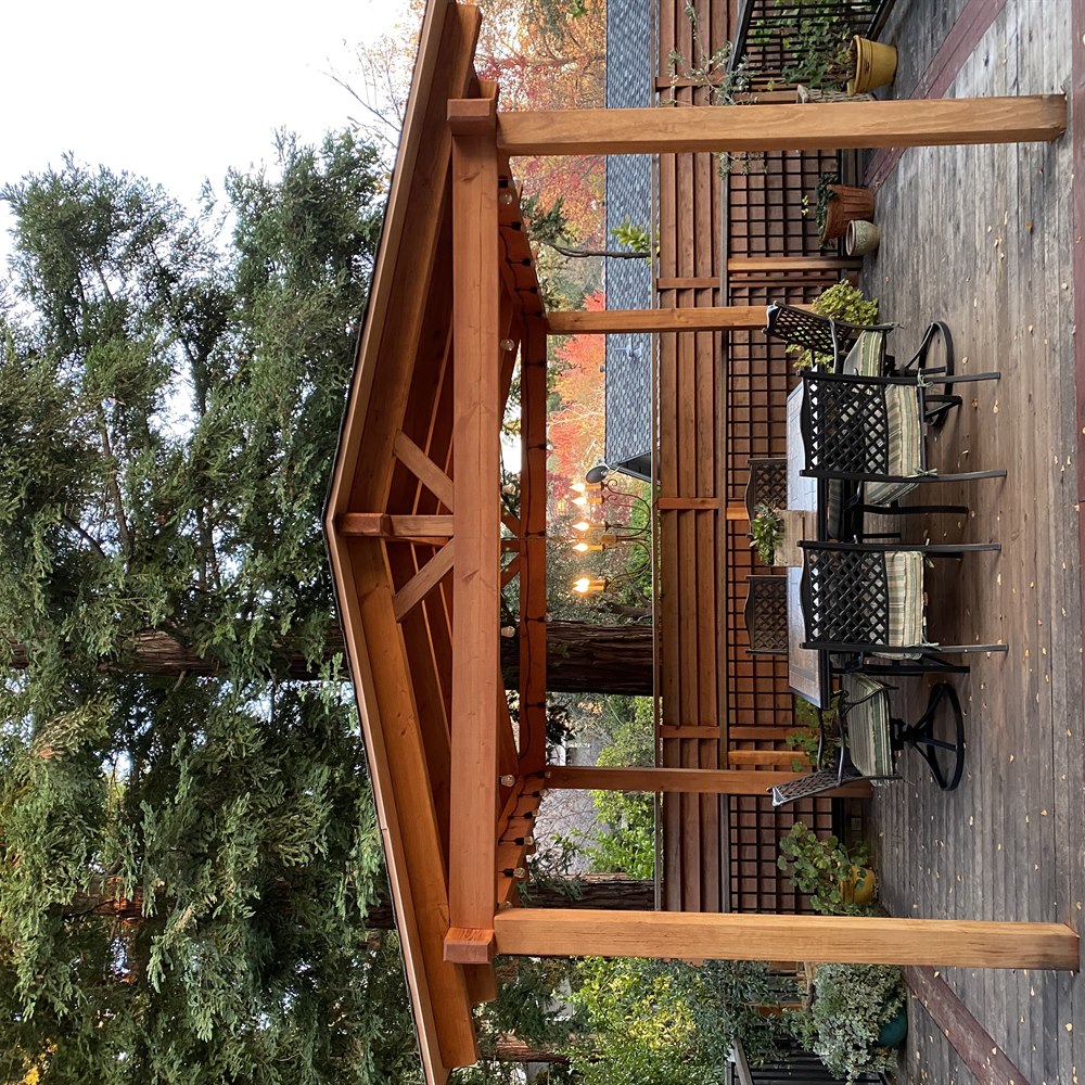 backyard-patio-with-wooden-pergola-and-furniture Backyard patio with wooden pergola and furniture