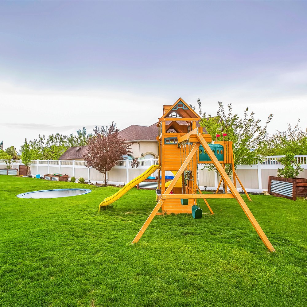 Backyard wooden playset with slide