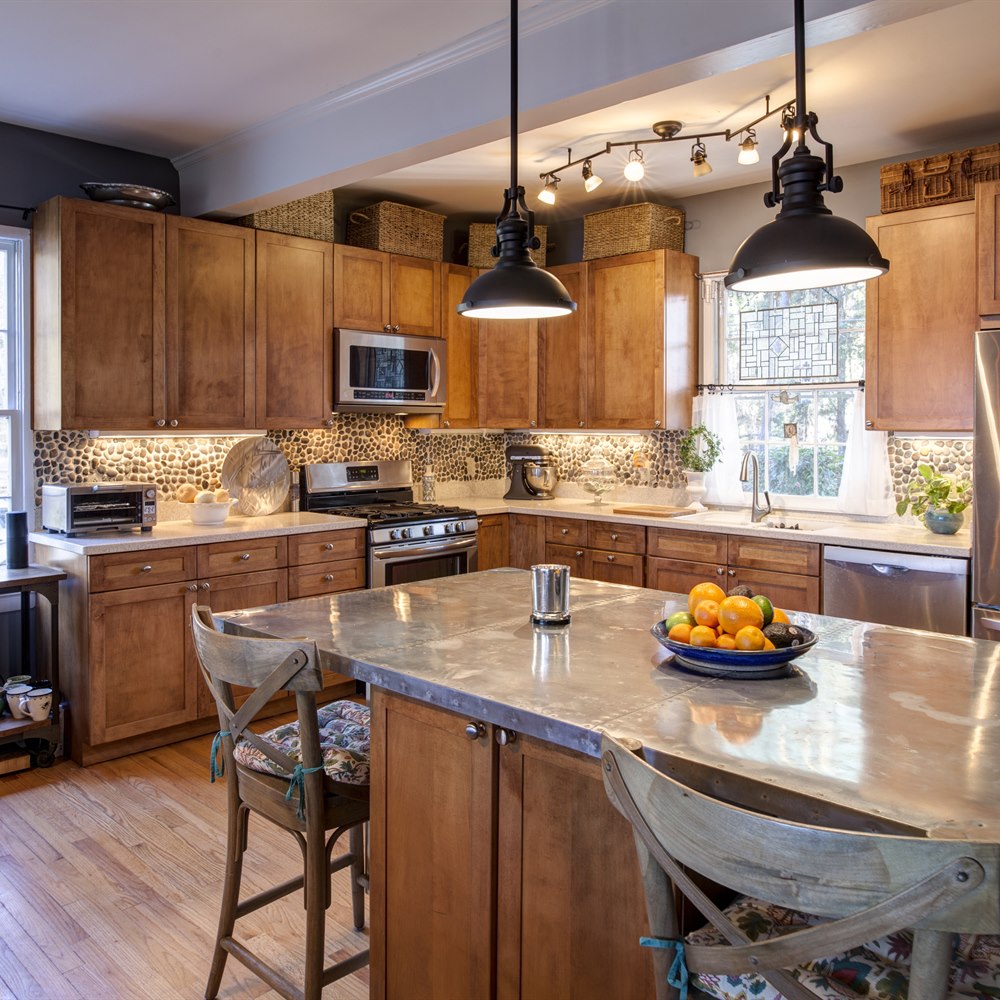 Bright modern kitchen interior with fruit and basket