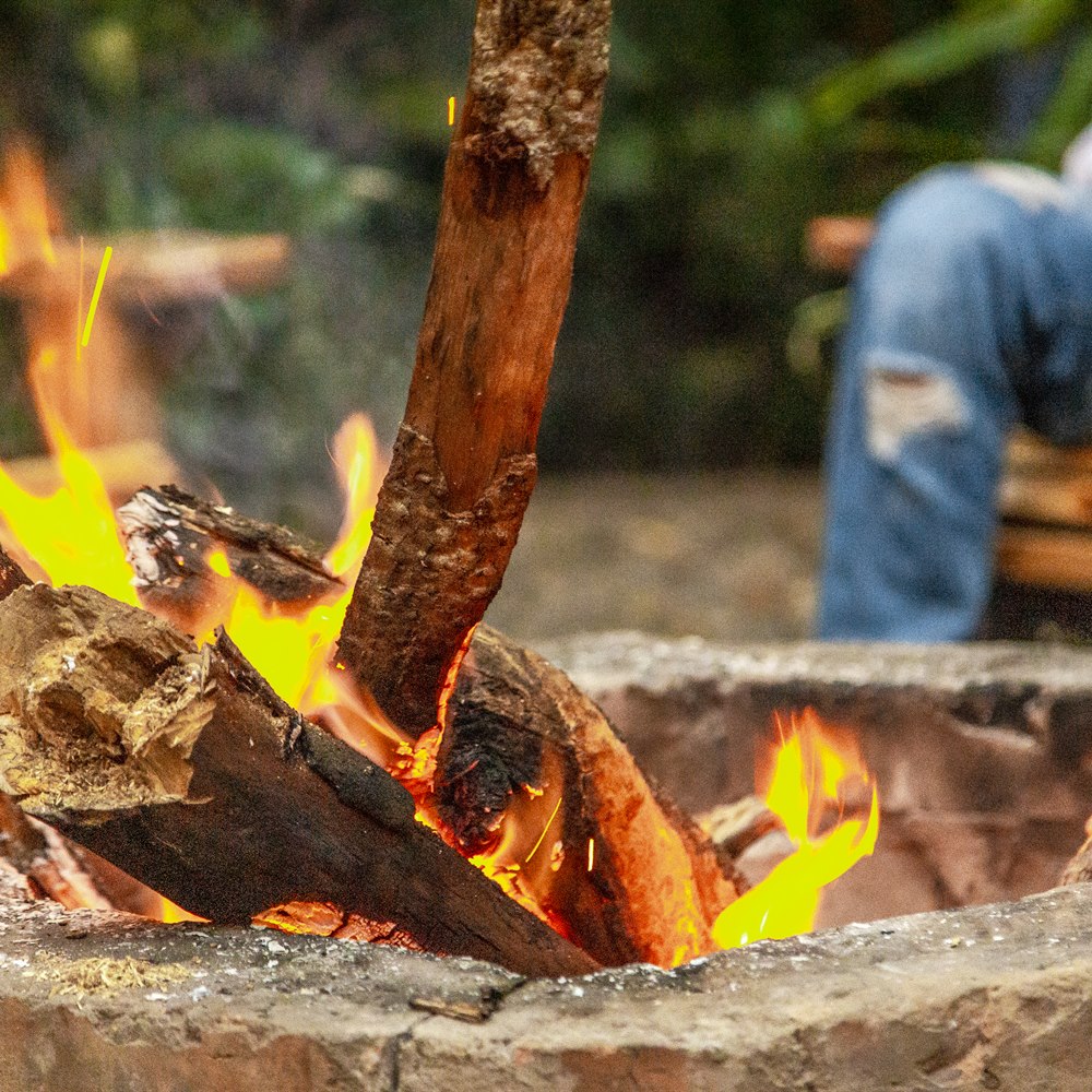 Burning fire pit with seating in nature