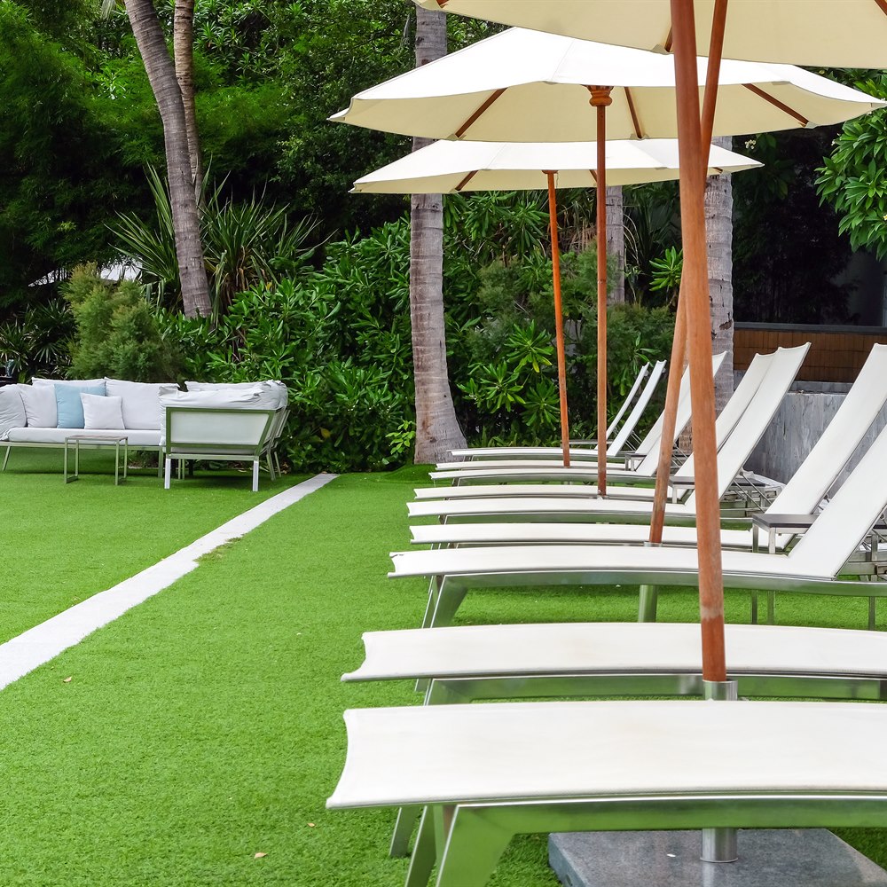 Comfortable lounge chairs by tranquil tropical grey