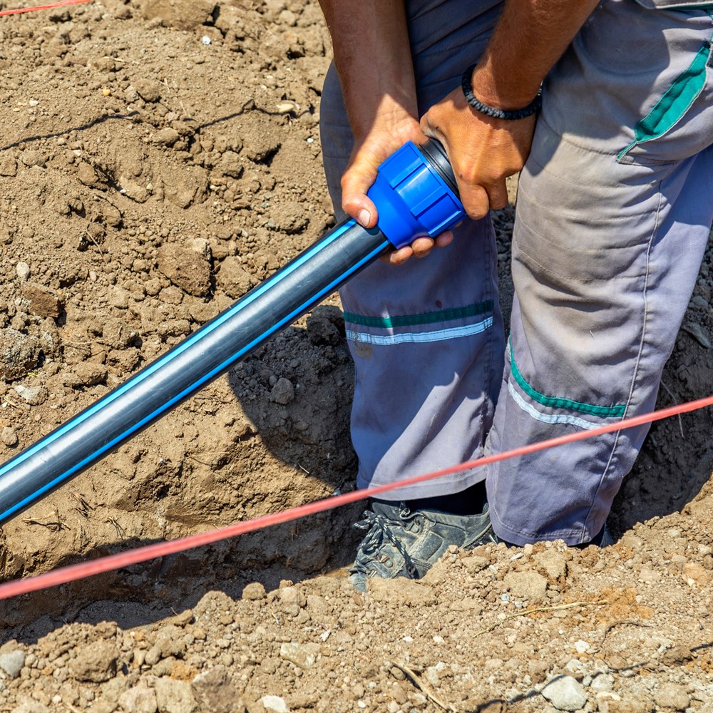 connecting-water-pipe-in-a-dug-trench Connecting water pipe in a dug trench
