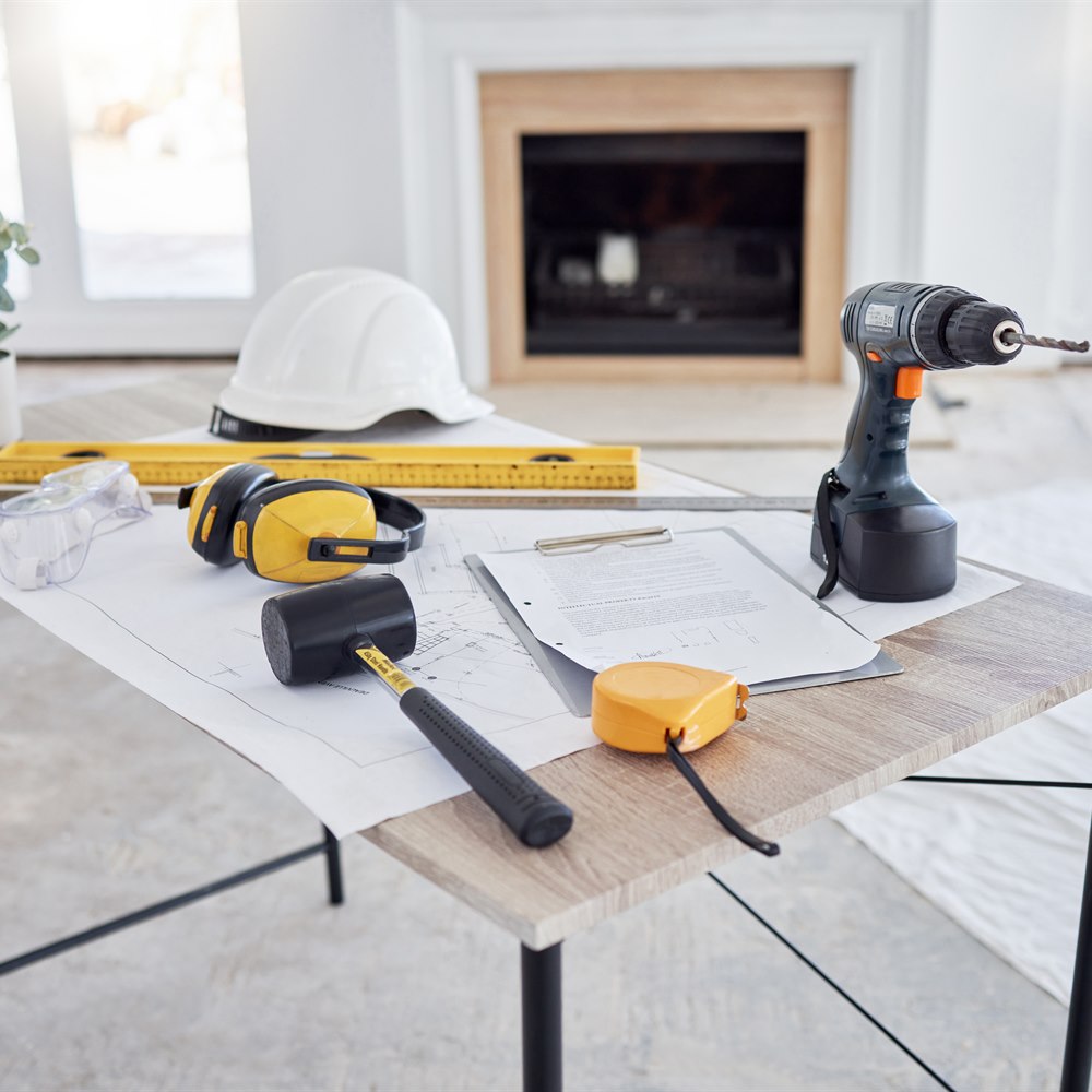 Construction tools on table in brightly lit room