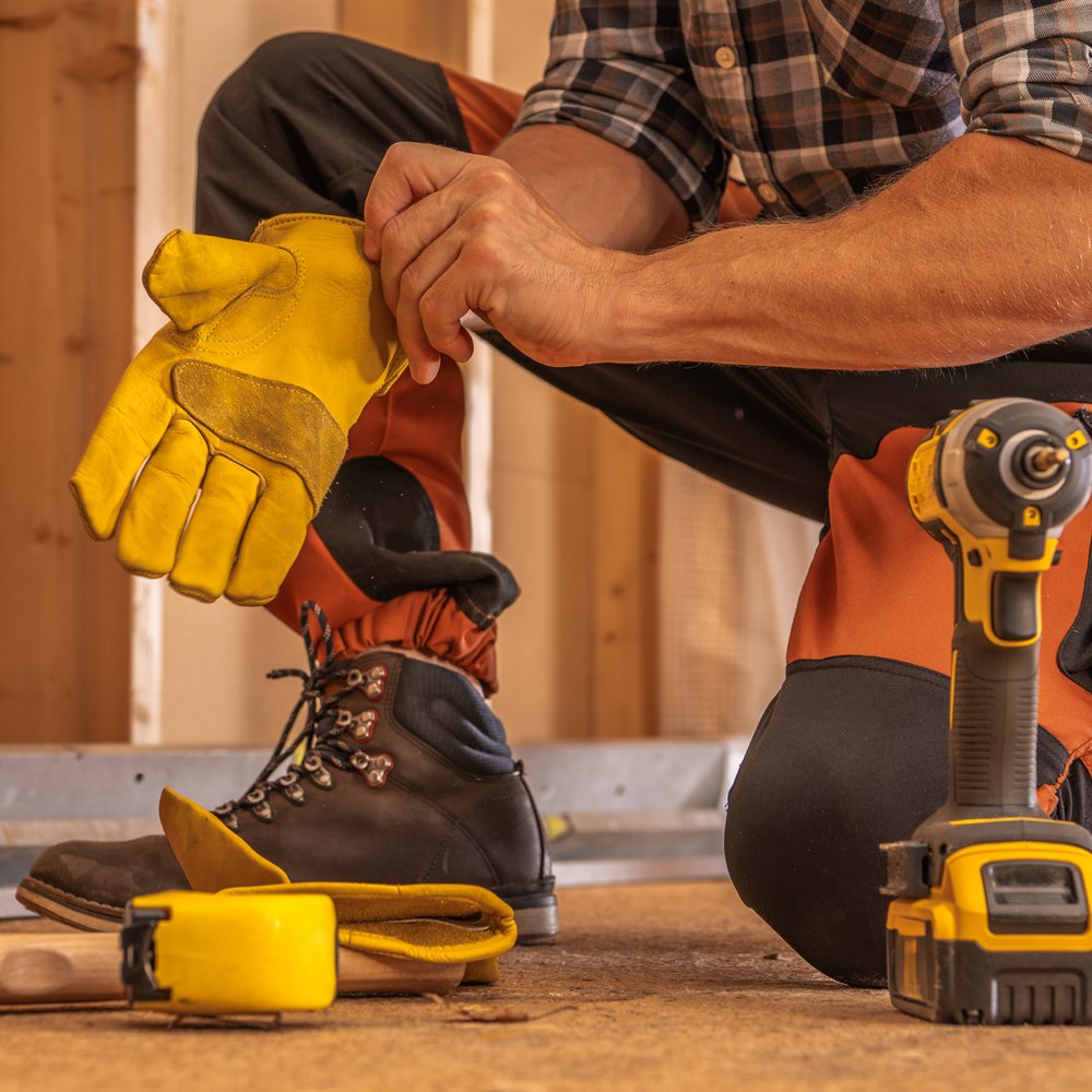 construction-worker-preparing-for-work-in-wood-set Construction worker preparing for work in wood set