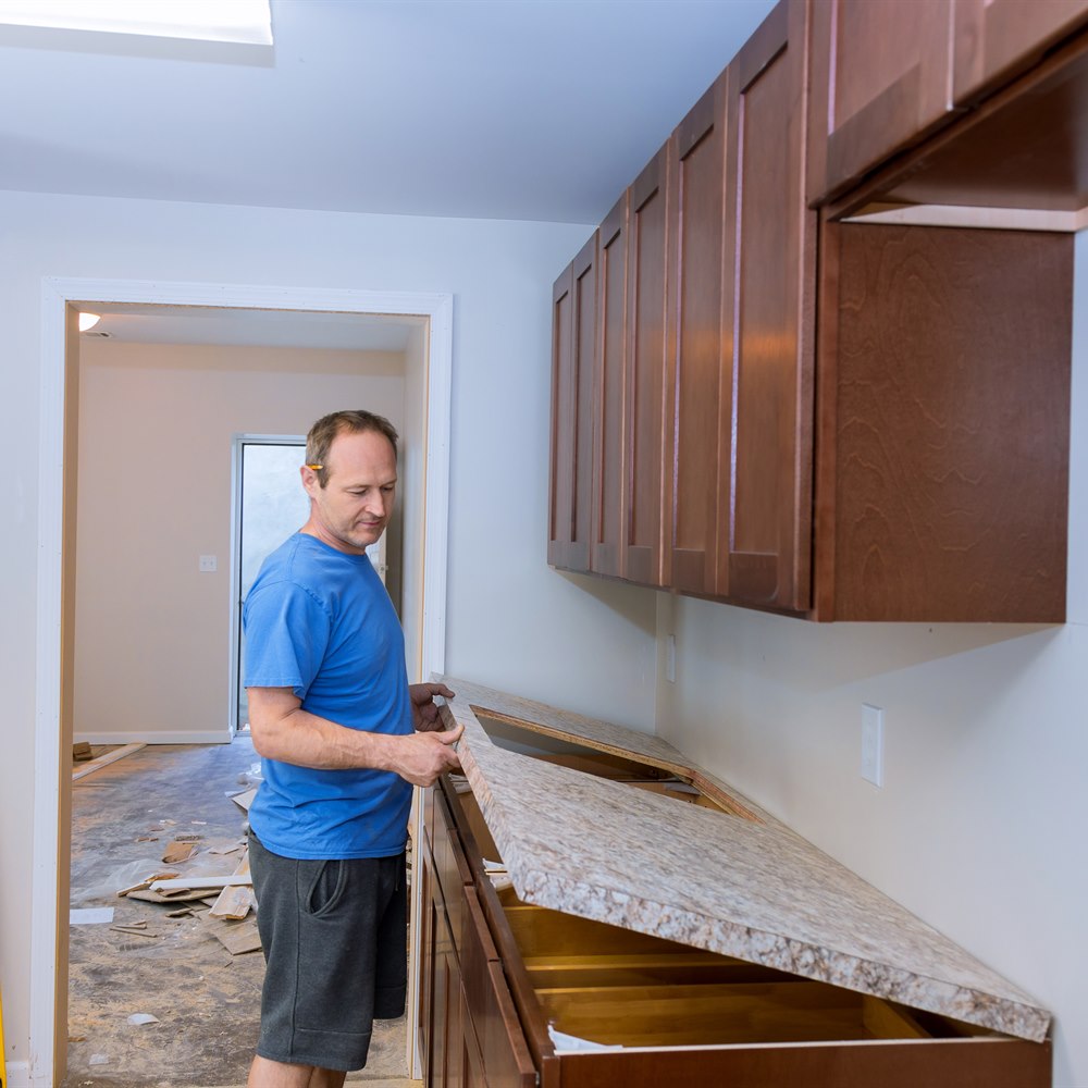 Contractor installs granite countertop in new home