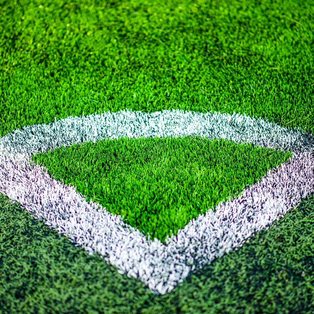 Corner kick green artificial turf with white line