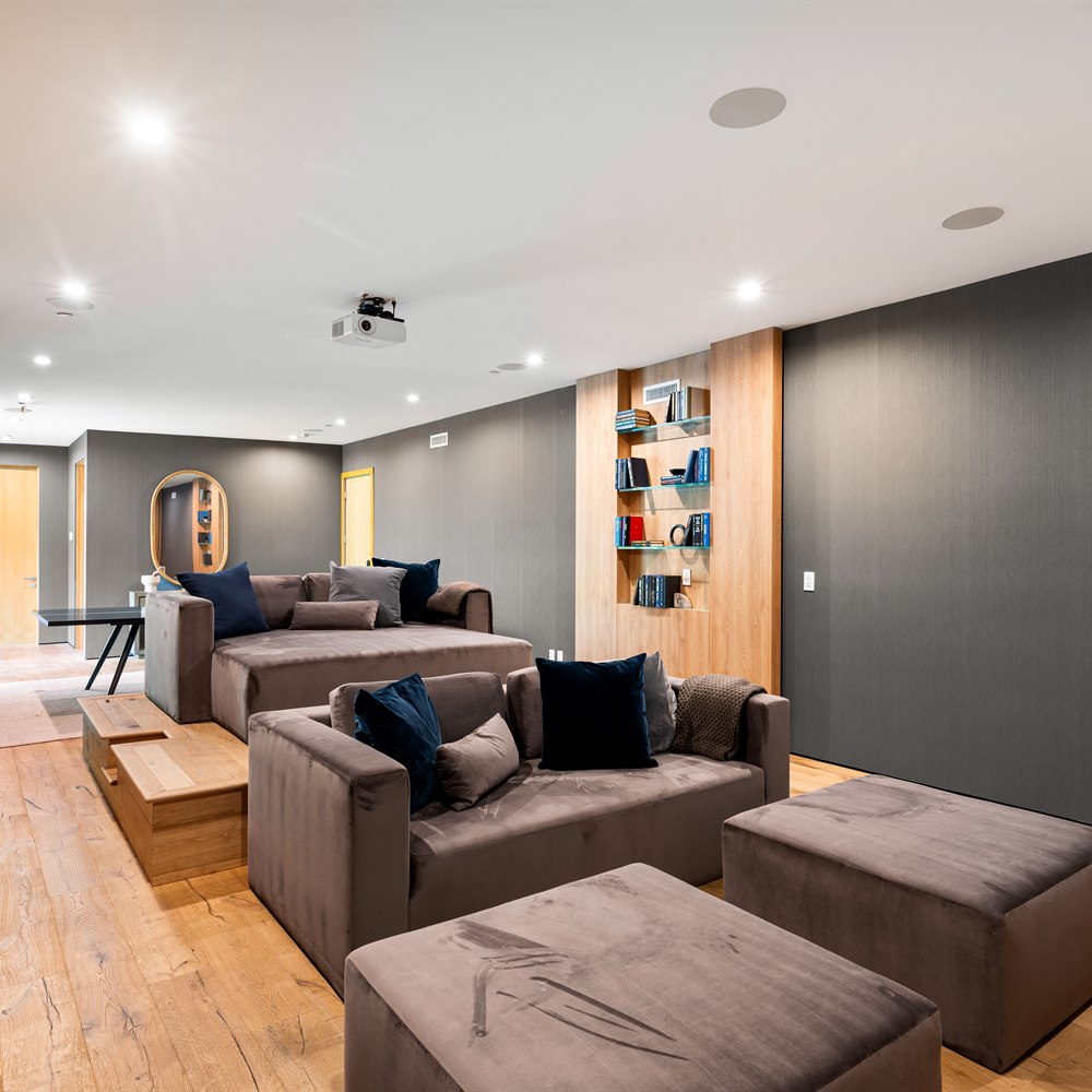 Cozy home theater room with plush furniture