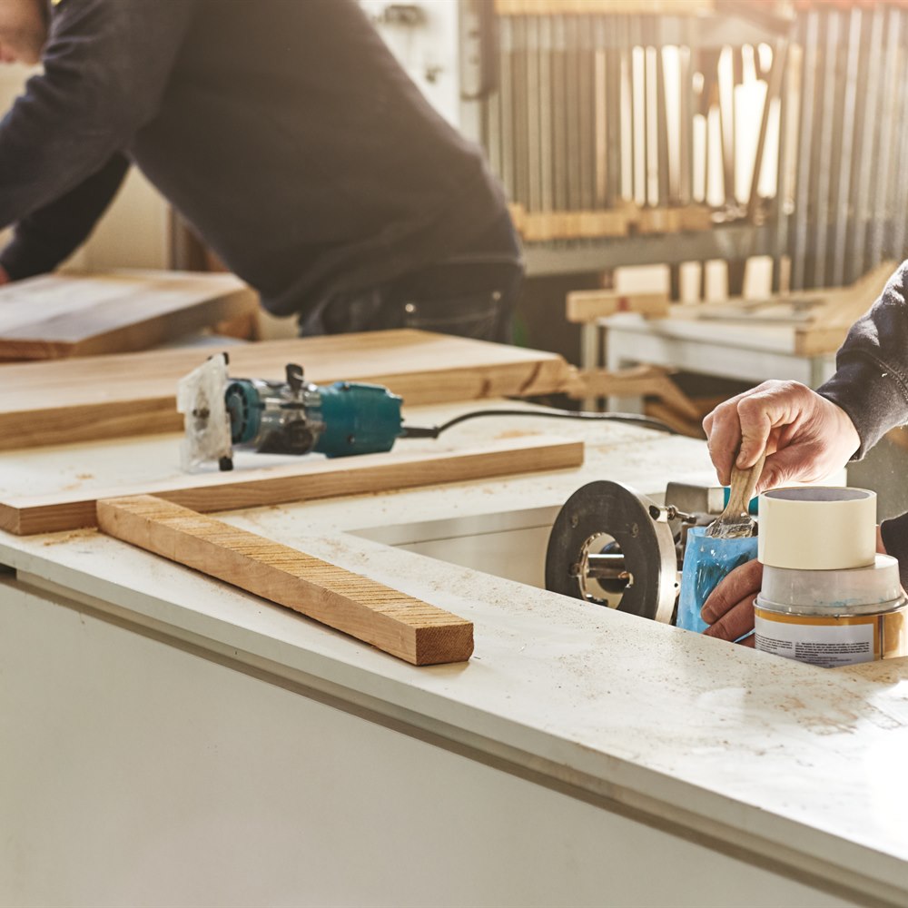 Craftsmen working with wood in workshop