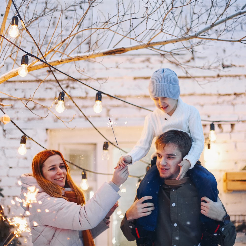 festive-family-celebrates-with-sparklers-outdoors Festive family celebrates with sparklers outdoors