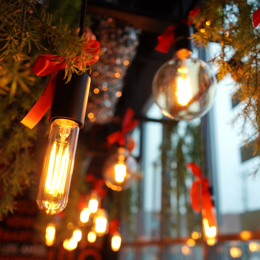 Festive holiday lighting with red ribbons