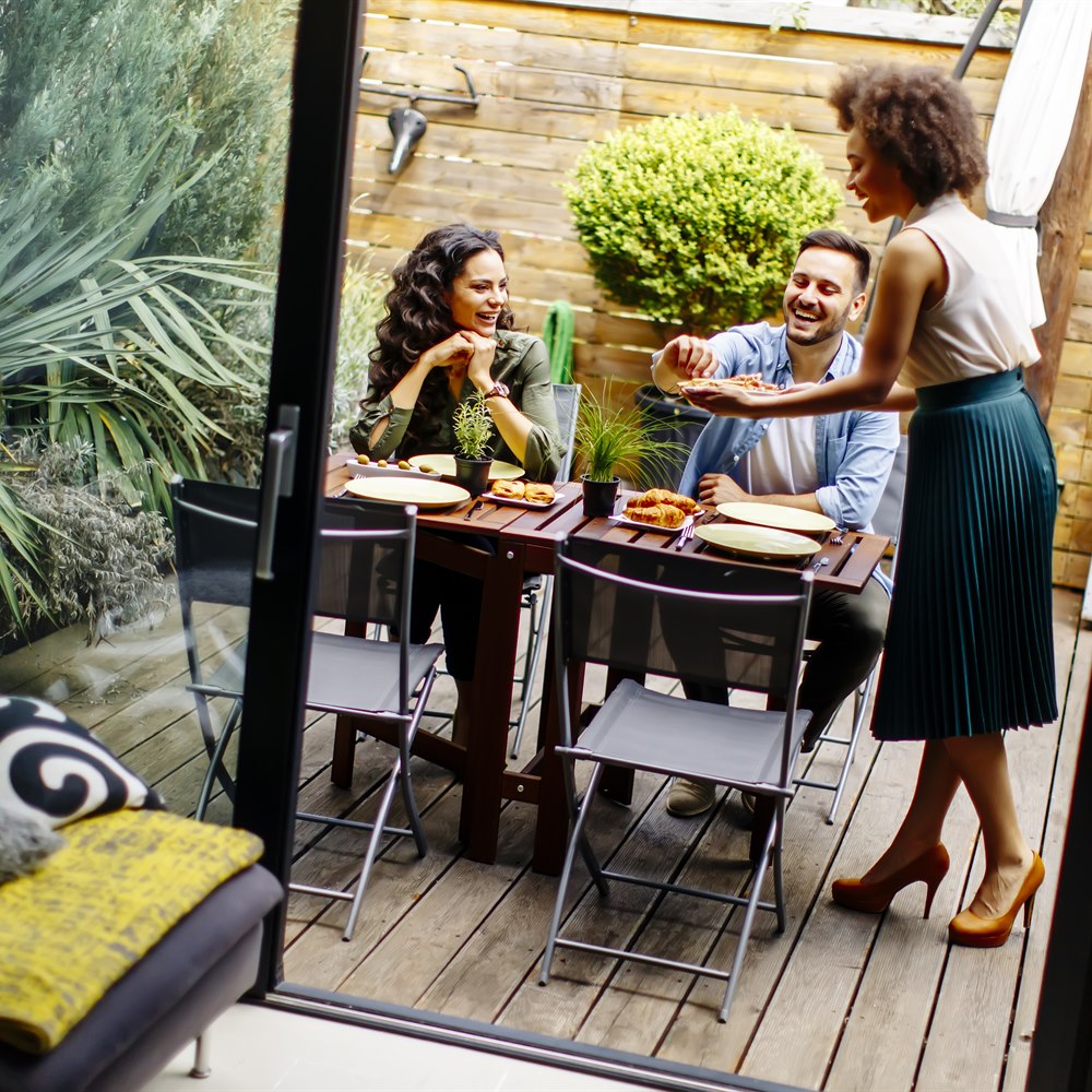 Friends enjoying lunch together on an urban patio