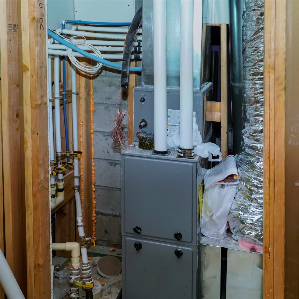 Furnace and water pipes in a home utility