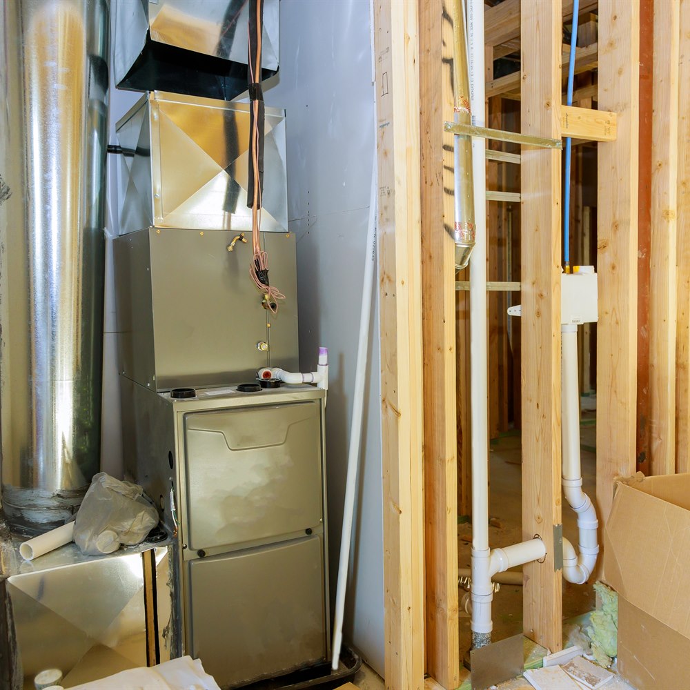 Furnace installation inside home under construction