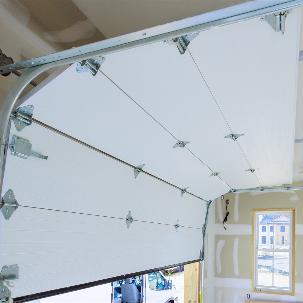 Garage door installation with white panel door