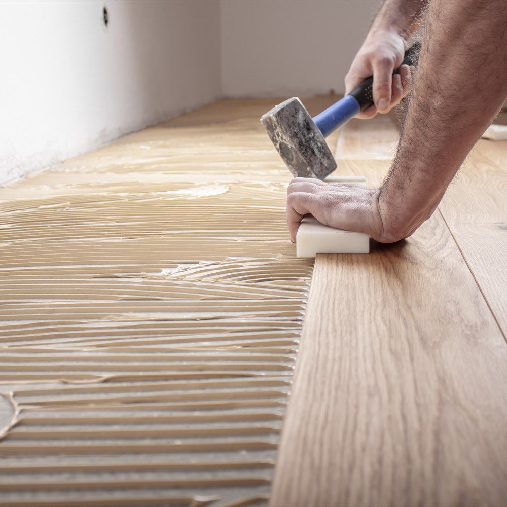Gluing engineered wood flooring