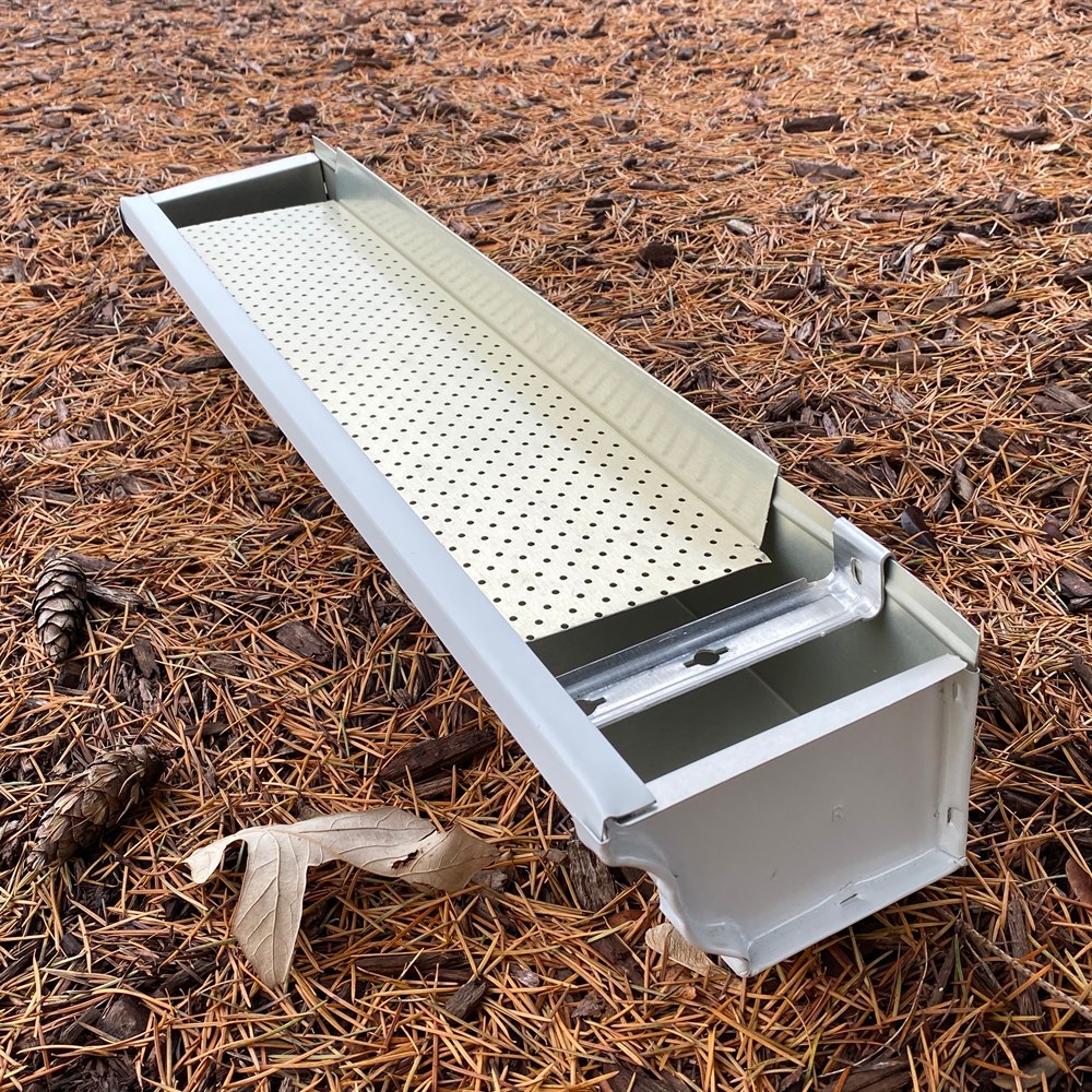 Gutter guard section on ground