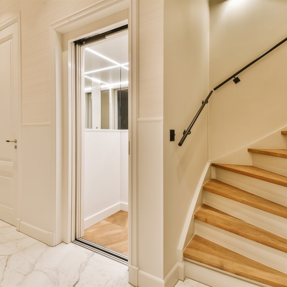 Hallway interior with stairs and elevator