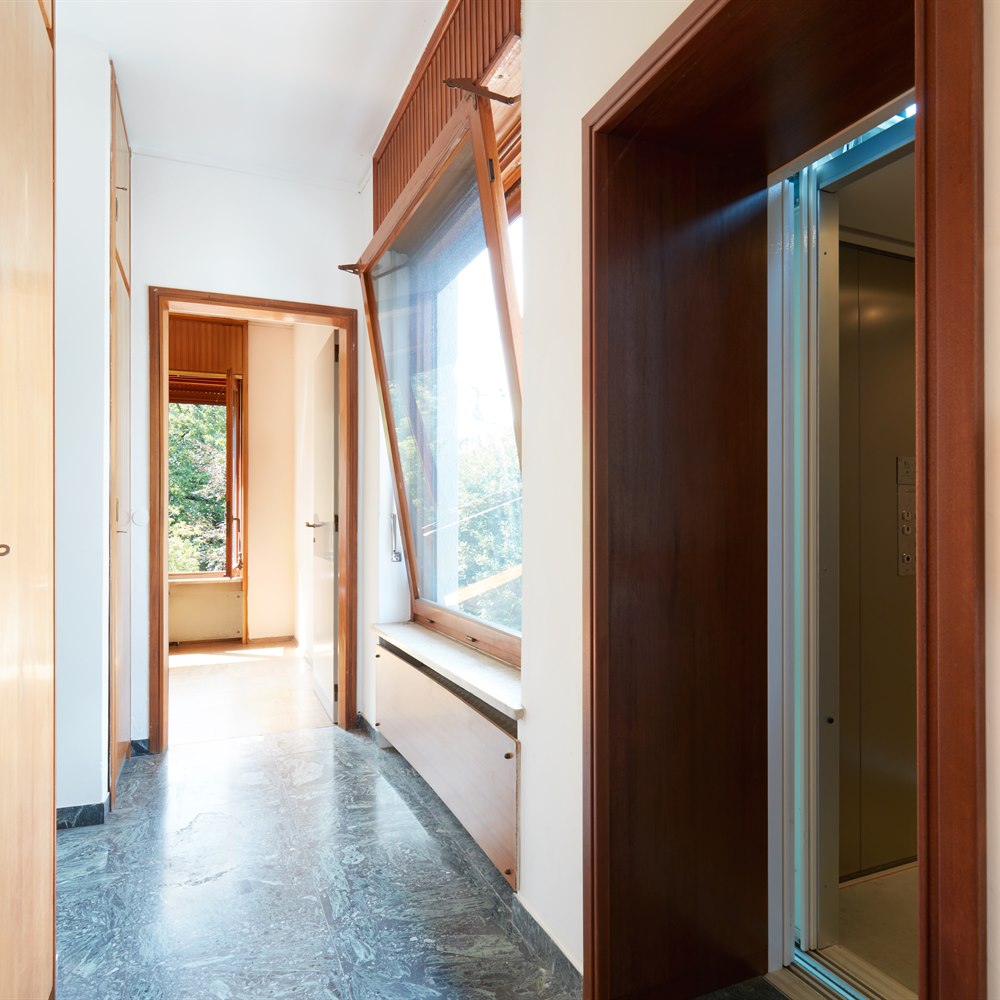 Hallway with doors and window in modern home