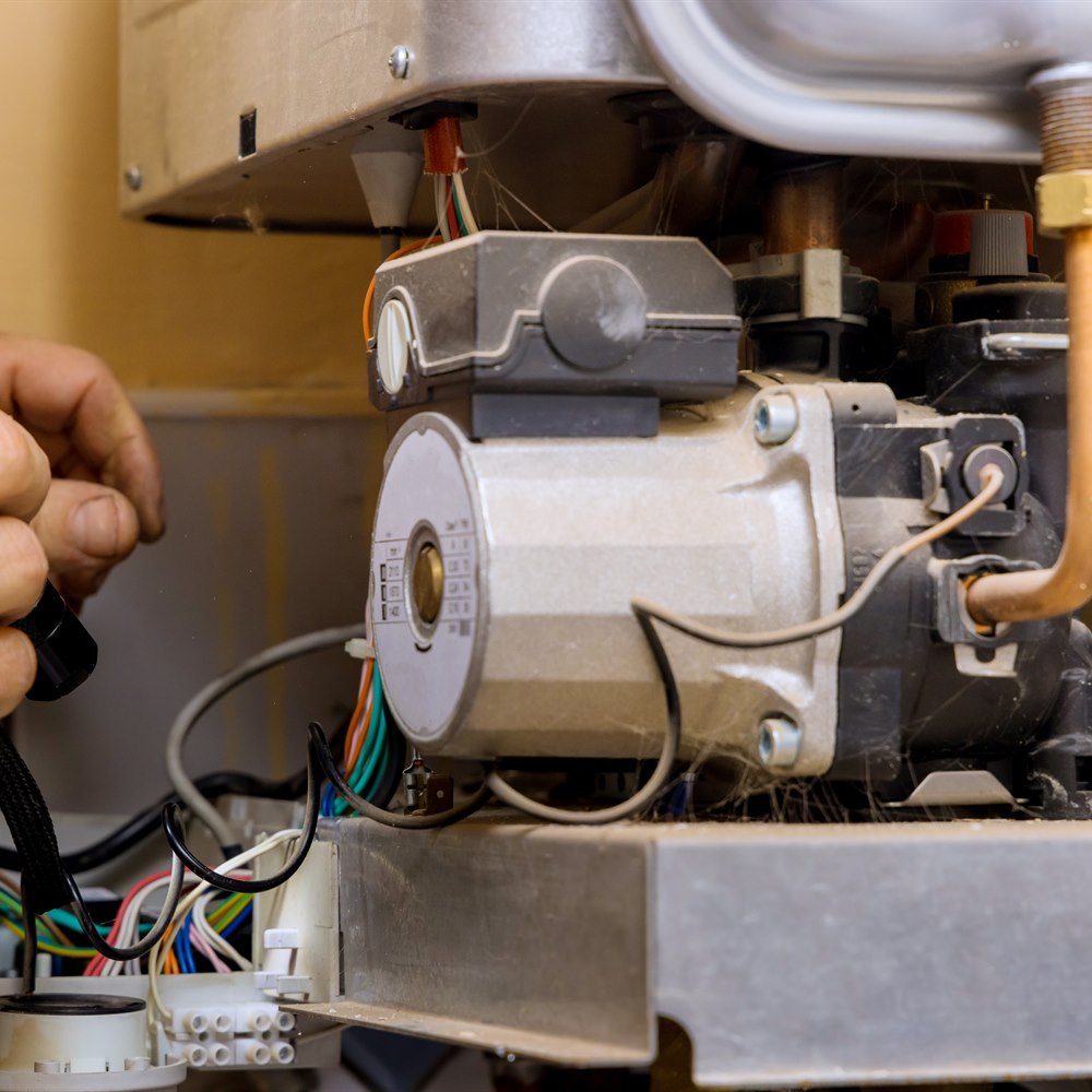 hands-repairing-mechanical-equipment-with-wiring Hands repairing mechanical equipment with wiring