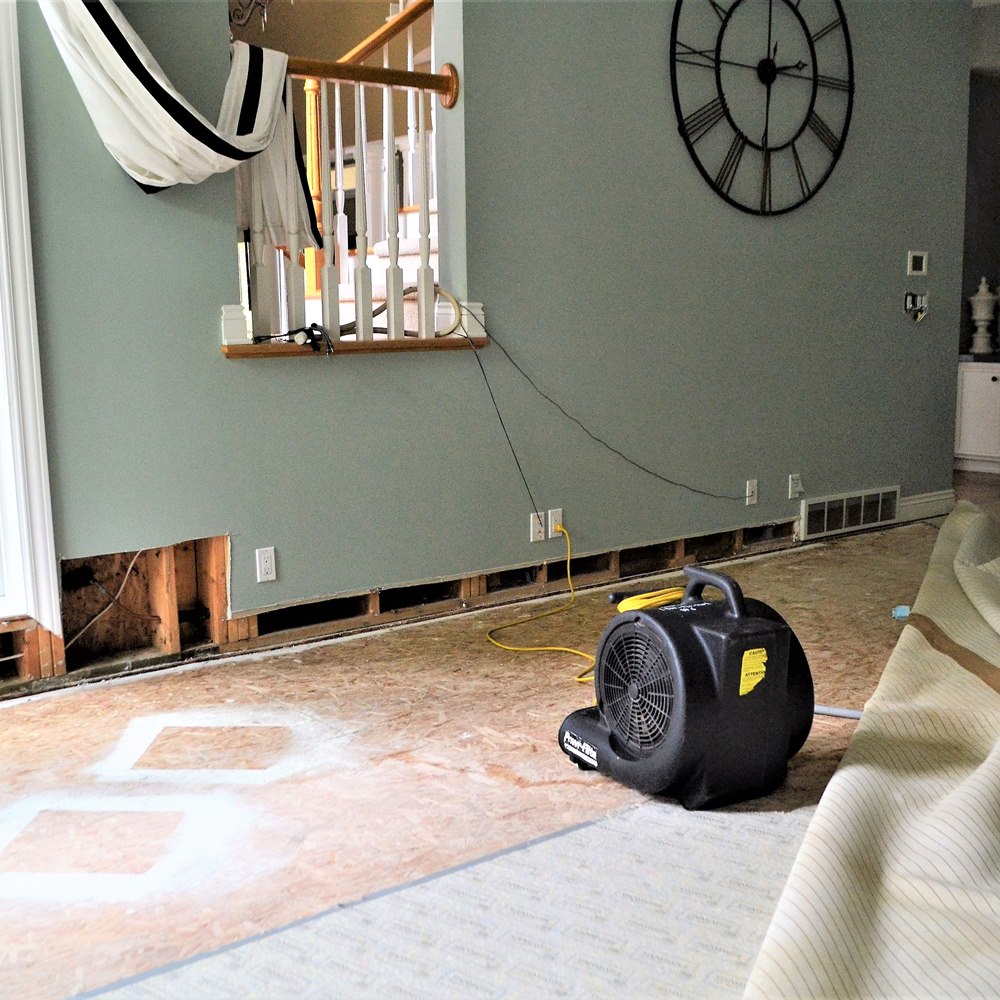 home-water-damage-restoration-with-air-movers Home water damage restoration with air