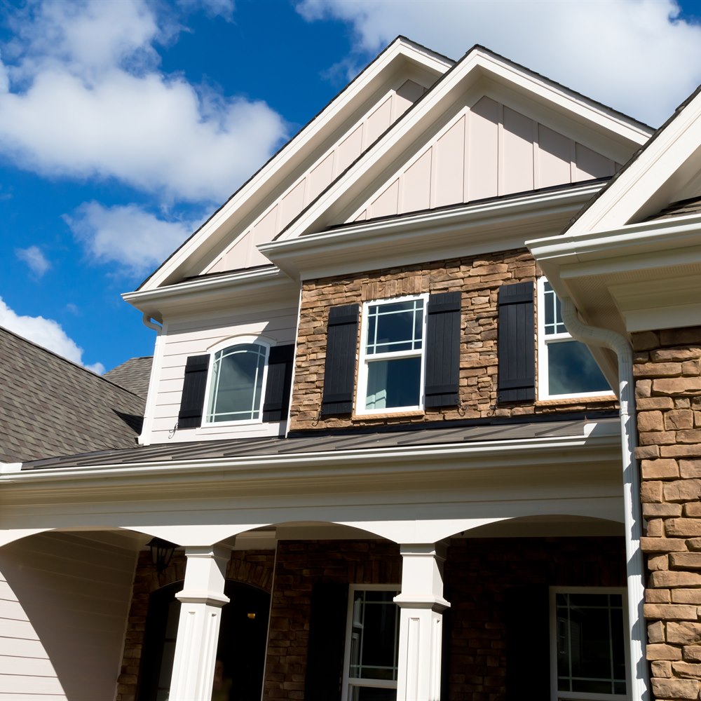House exterior with siding and stone