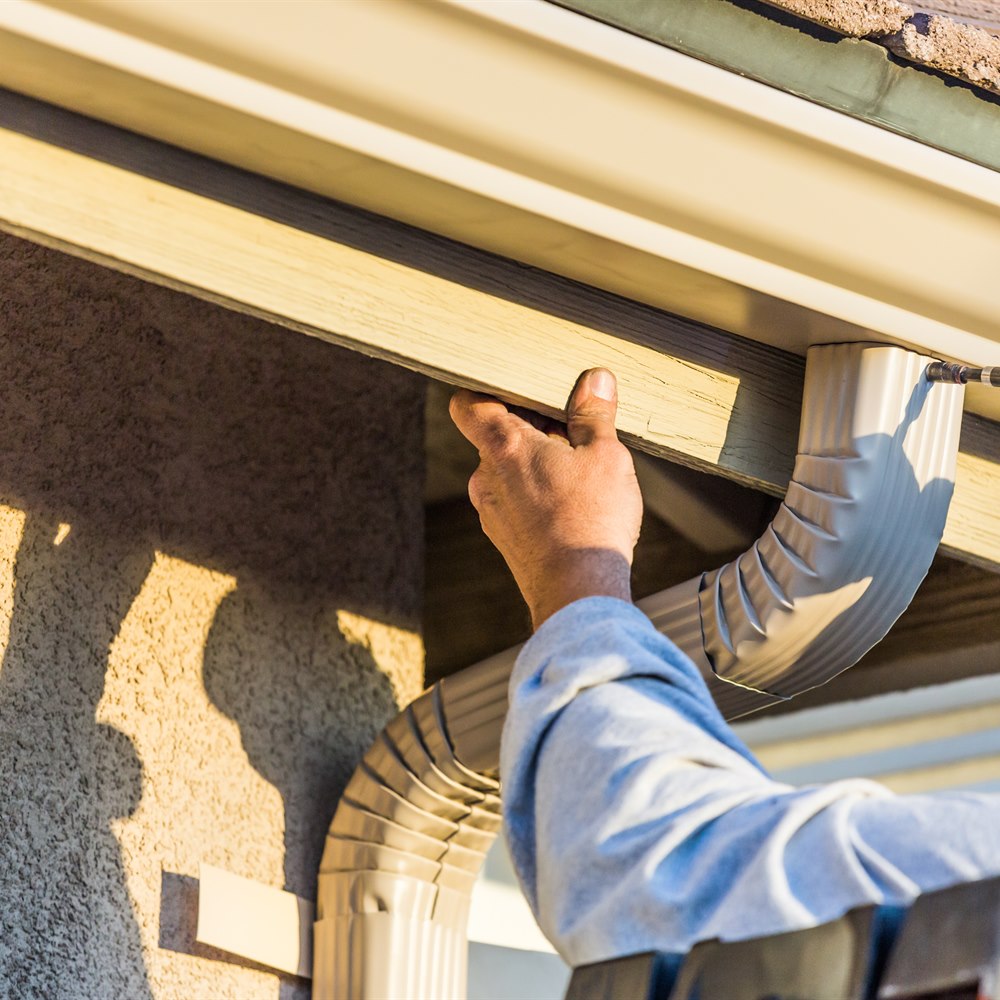 installing-gutter-downspout-elbow Installing gutter downspout elbow