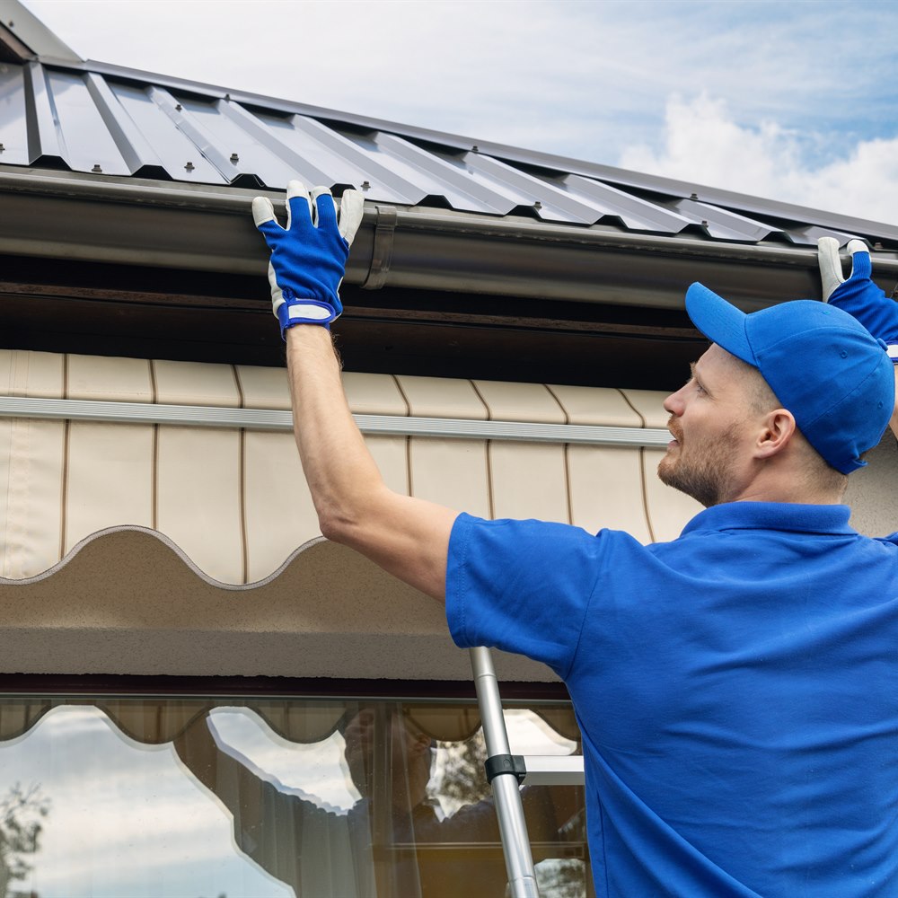 installing-gutter-under-metal-roof Installing gutter under metal roof