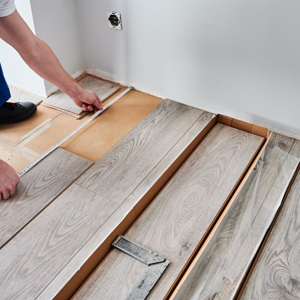 Installing new wood laminate flooring in home
