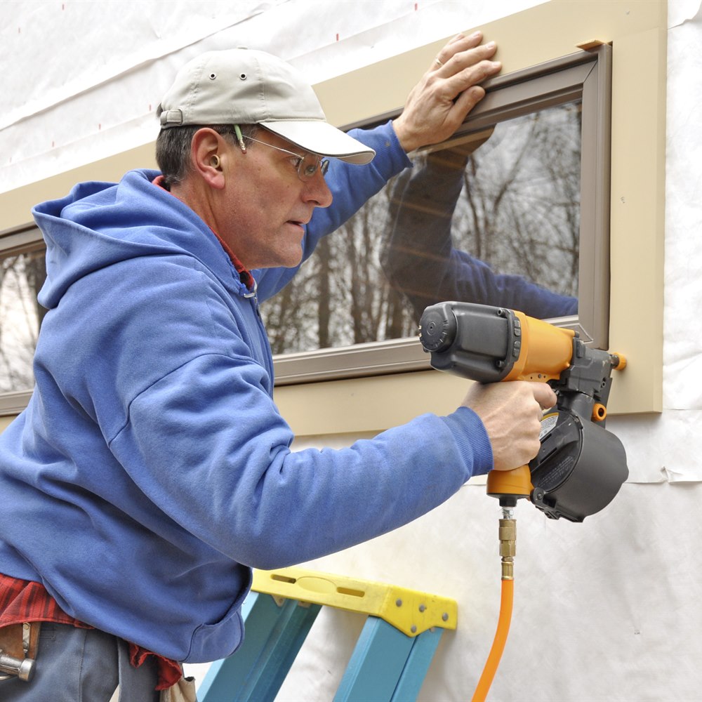 Installing window trim on housewrap