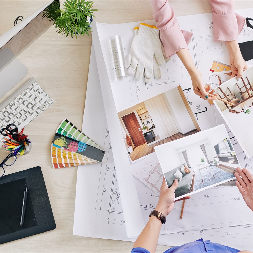 Interior designers work on design project in office