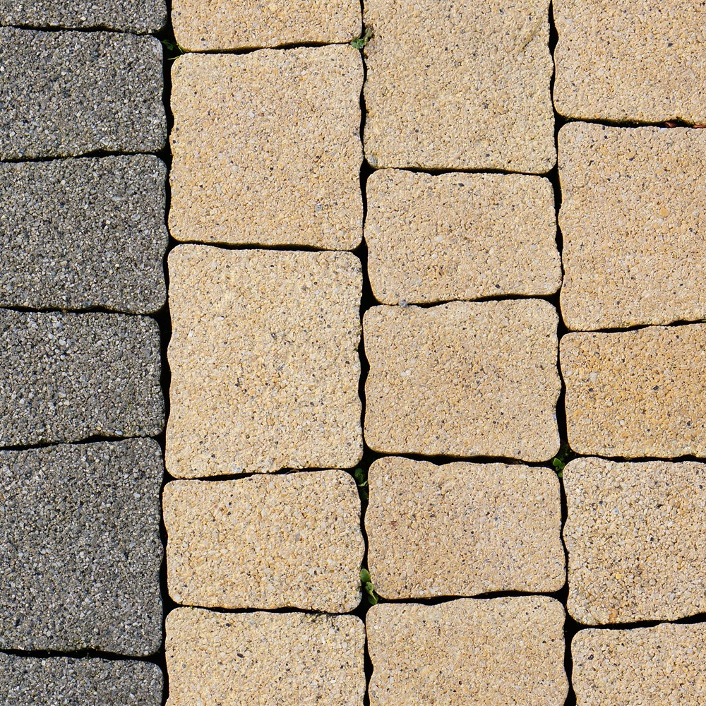 Interlocking concrete pavers in grey and yellow