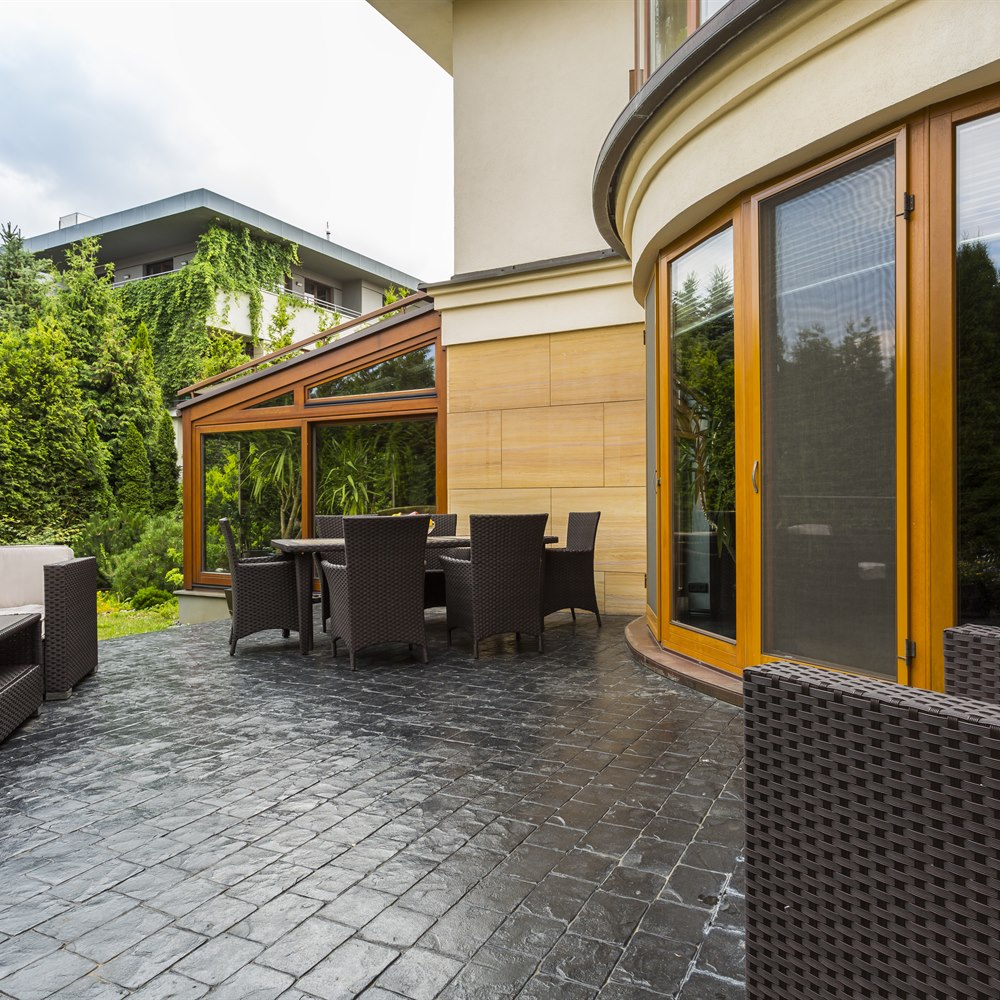 Inviting patio with brown wicker furniture