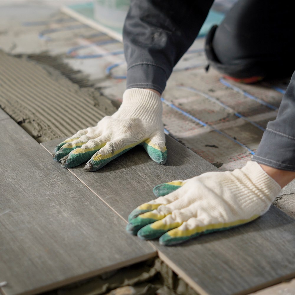 laying-floor-tile-on-adhesive Laying floor tile on adhesive
