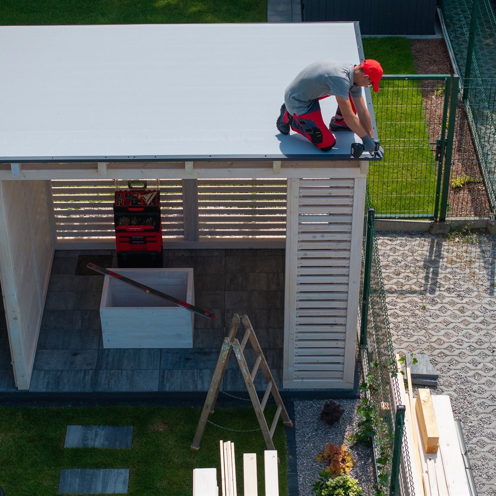 Man working on roof of a building