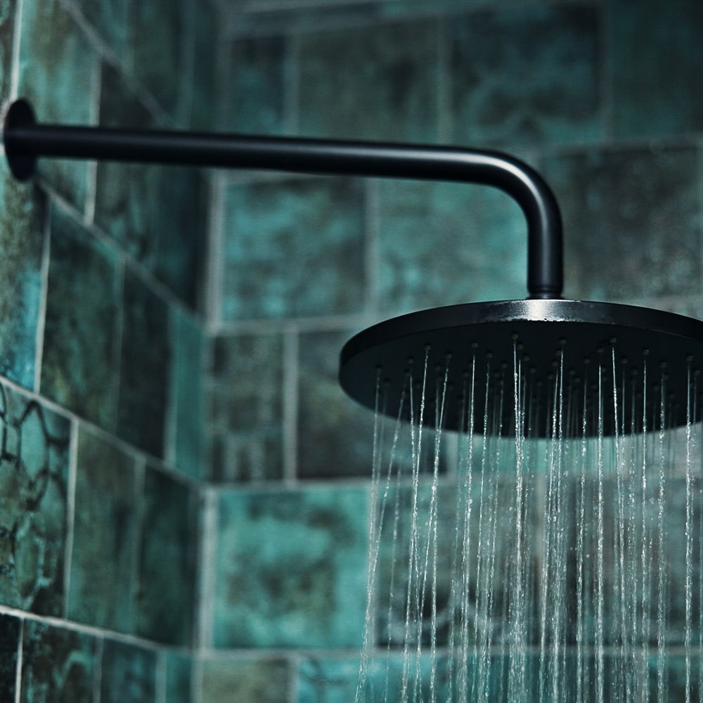 Modern black rainfall shower head running