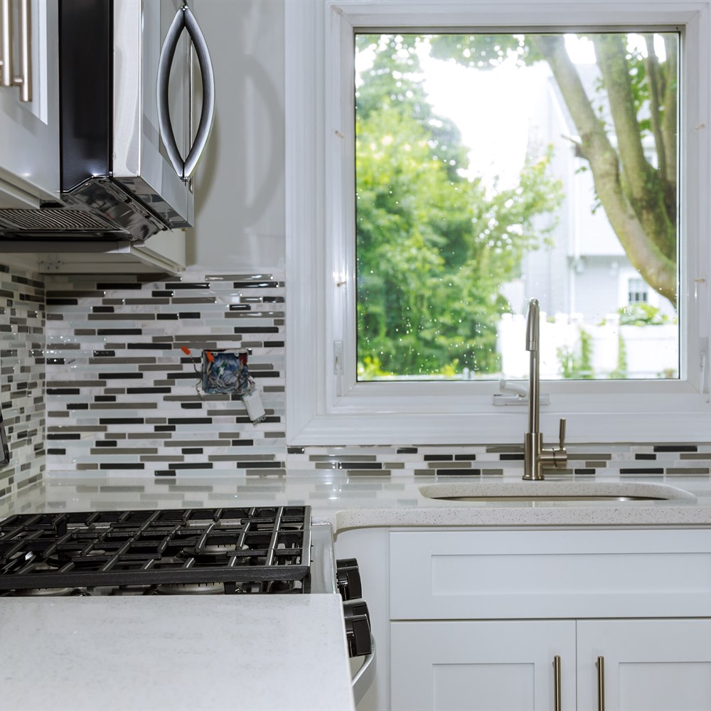 Modern kitchen interior with white cabinets