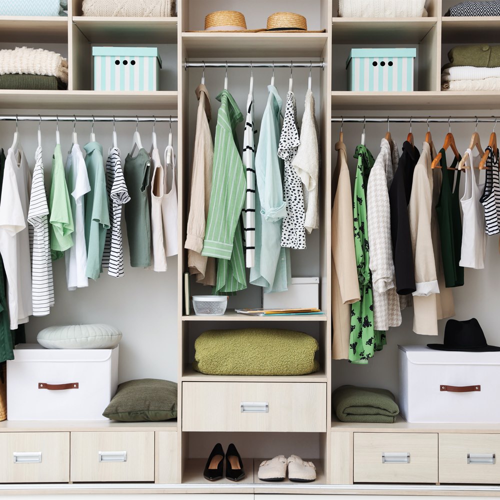 neatly-organized-modern-wardrobe-with-color-coordi Neatly organized modern wardrobe with color