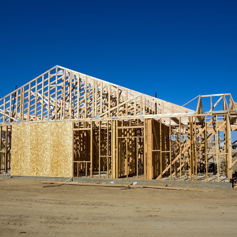 New house construction framework under blue sky