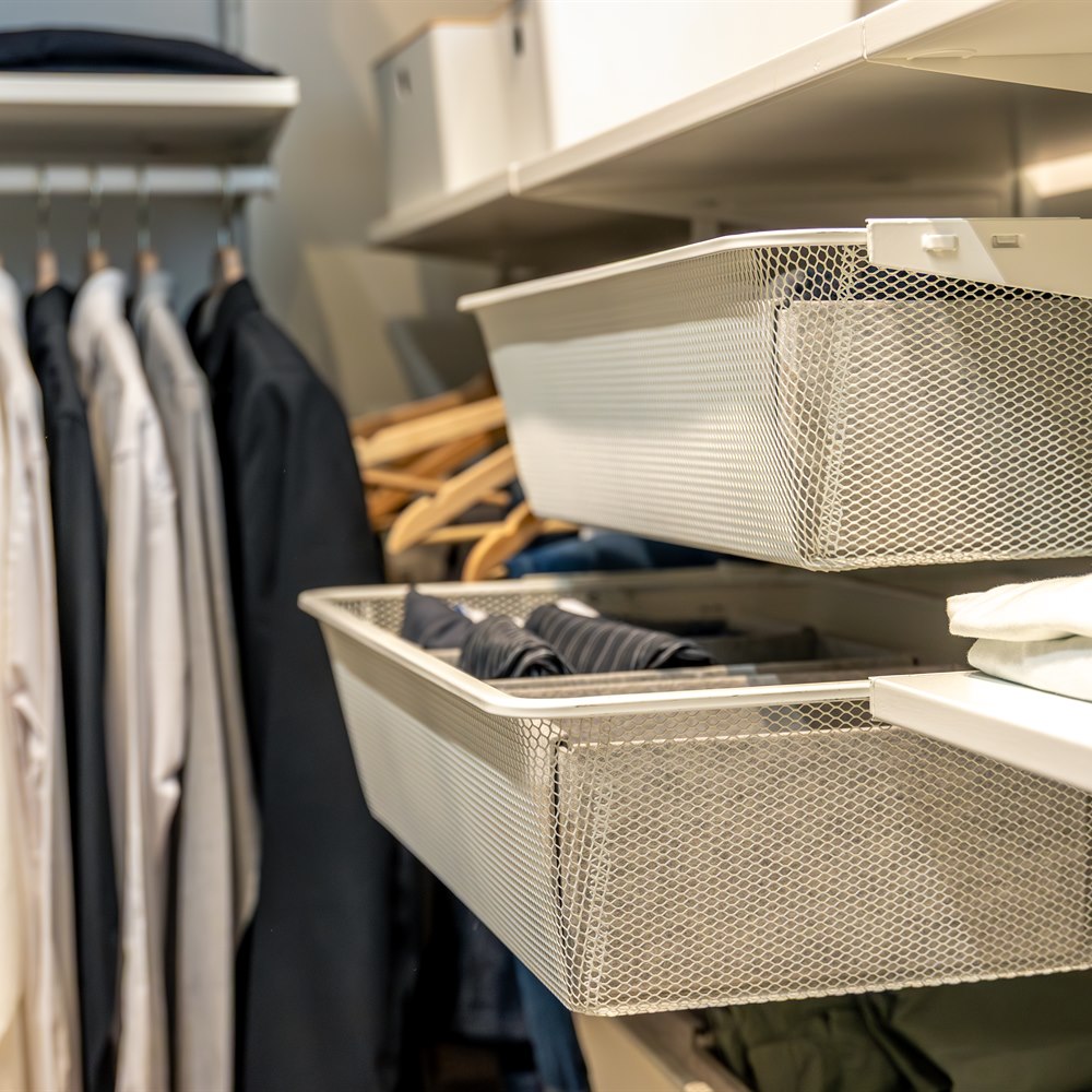 organized-closet-with-clothes-and-storage-baskets Organized closet with clothes and storage baskets