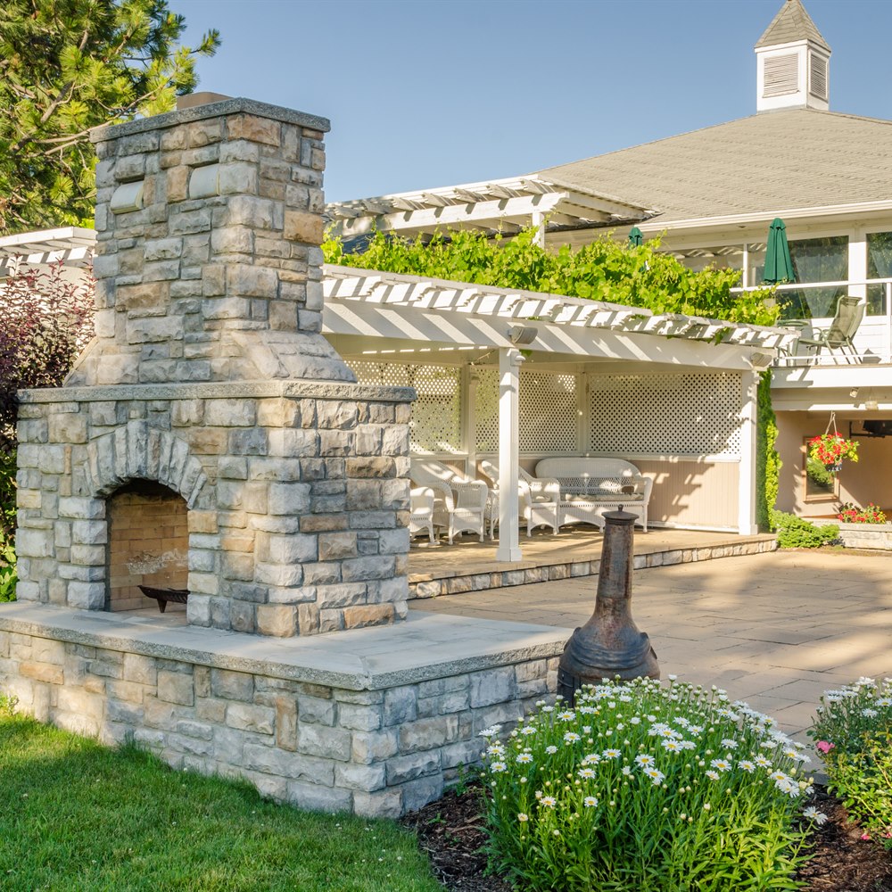 Outdoor stone fireplace on a patio