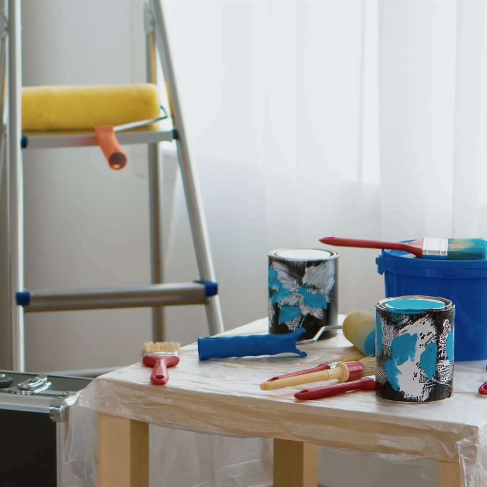 Paint supplies on table awaiting home project