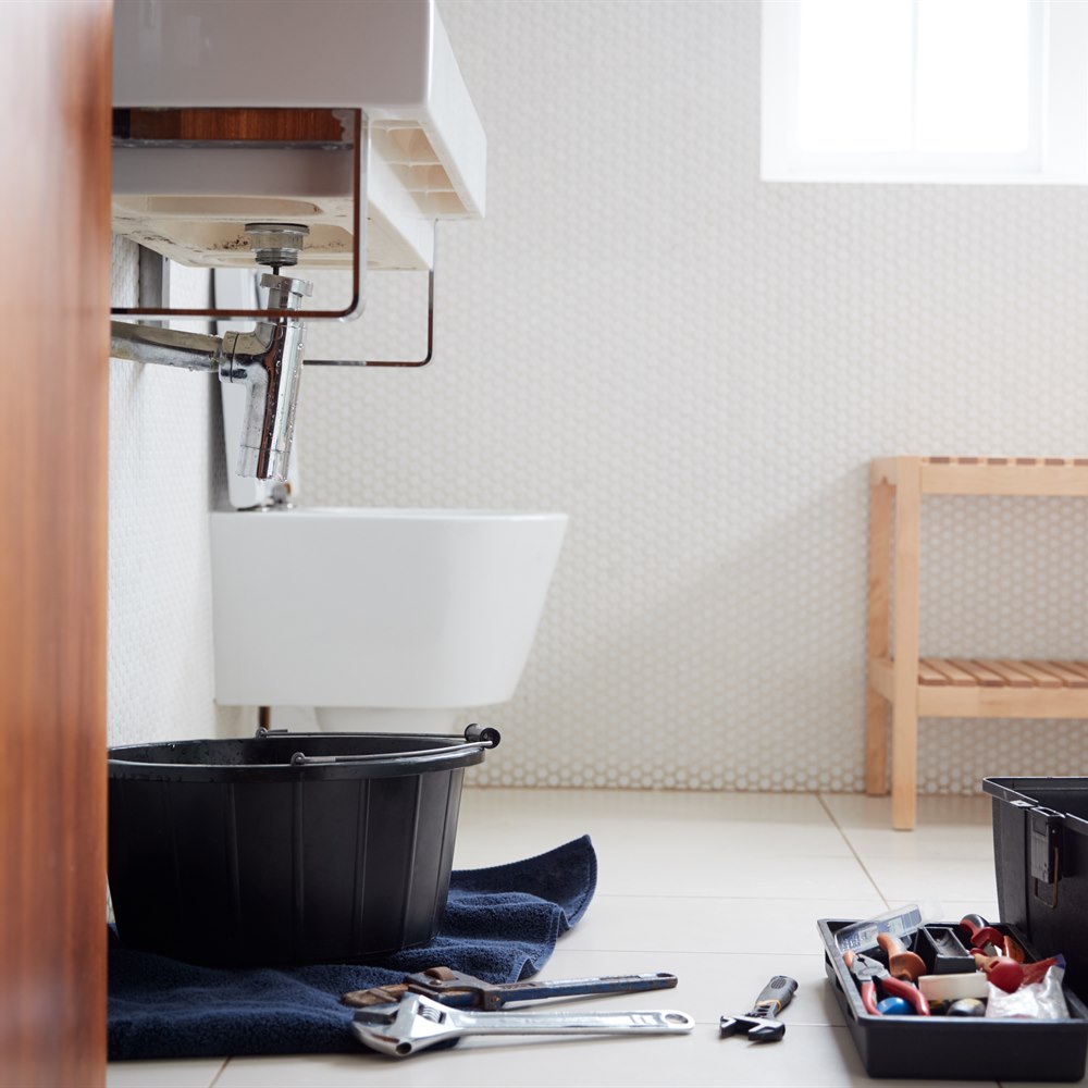 plumbing-tools-and-sink-repair-in-bathroom Plumbing tools and sink repair in bathroom