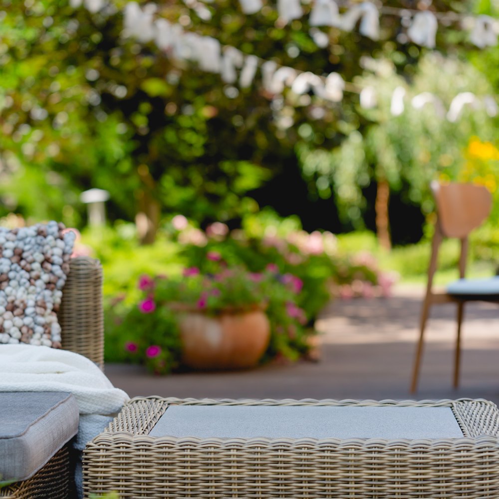 Relaxing patio setting with lush green garden
