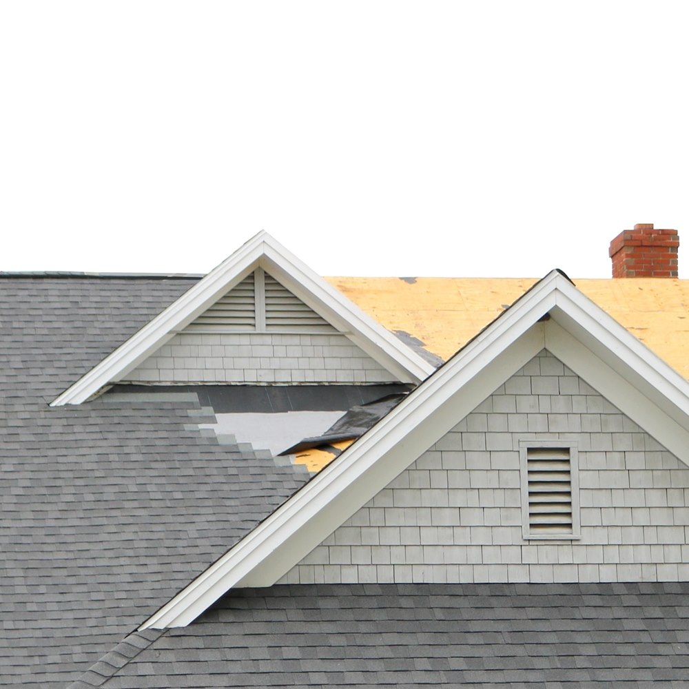 Roof half shingled showing bare sheathing