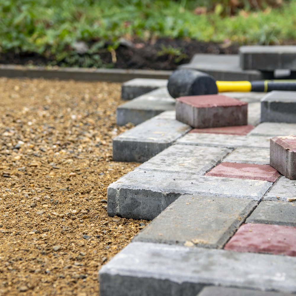 Setting pavers with a rubber
