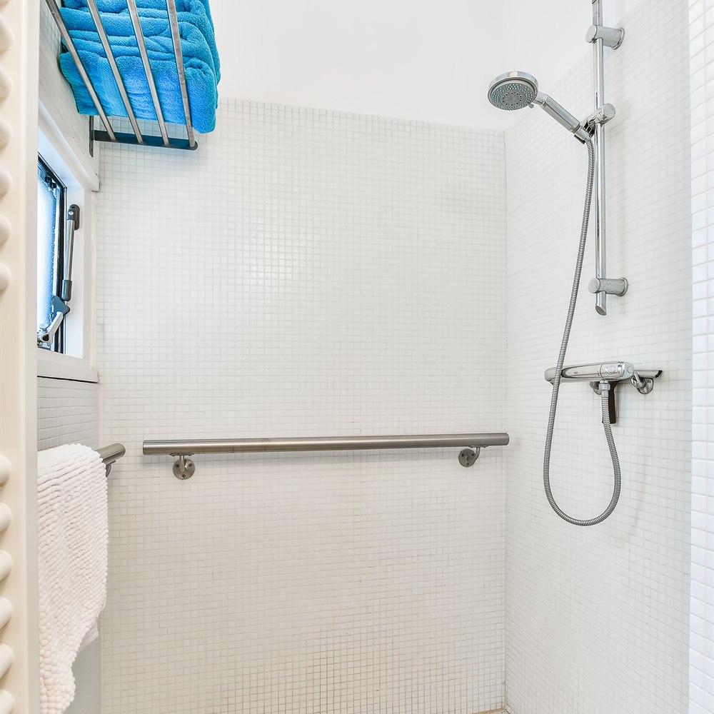 shower-room-interior-with-towels-and-grab-bar Shower room interior with towels and grab bar